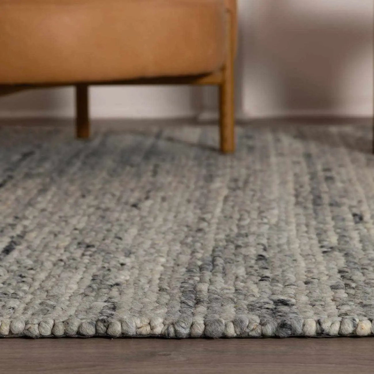 Olisa Gray Wool Area Rug, installed in a room 7