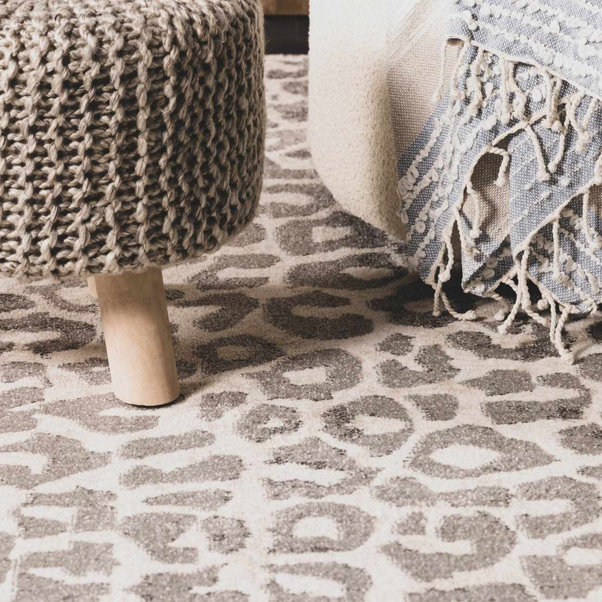 Beige Liversedge Leopard Print Area Rug, installed in a room 3