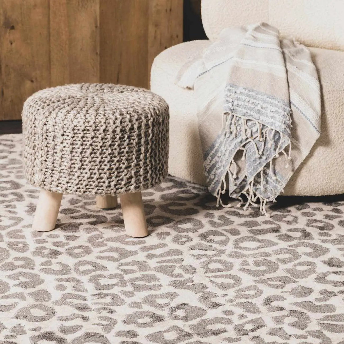 Beige Liversedge Leopard Print Area Rug, installed in a room 2