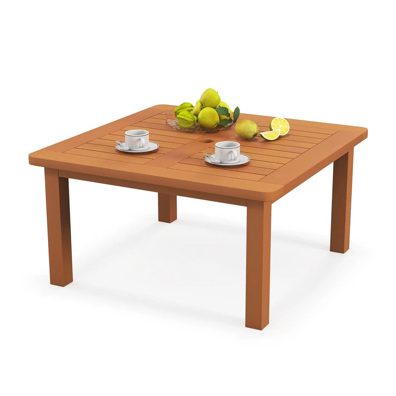 Patio Coffee Table with Umbrella Hole and Teak Oil Finish by DirectDeals