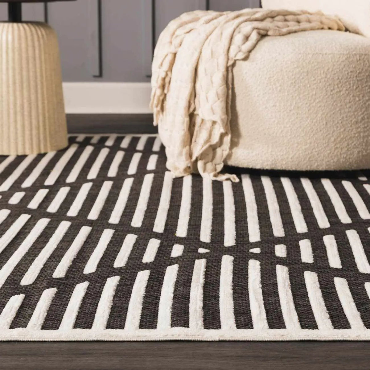 Anah 3D Black Outdoor Rug, installed in a room 3