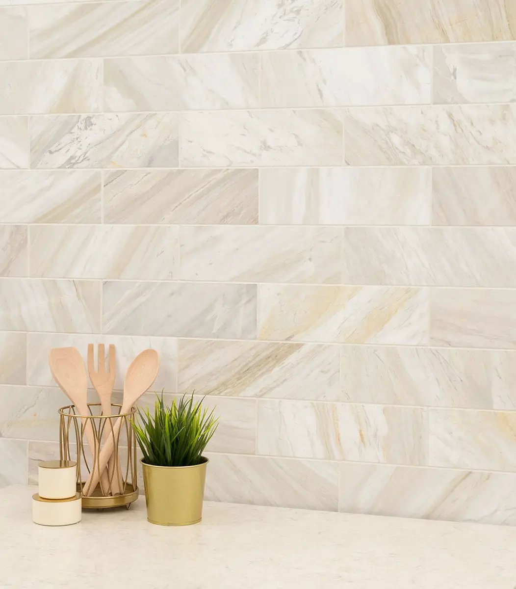 Athena Gold Tile 4x12 Honed Marble Mosaics in a finished room