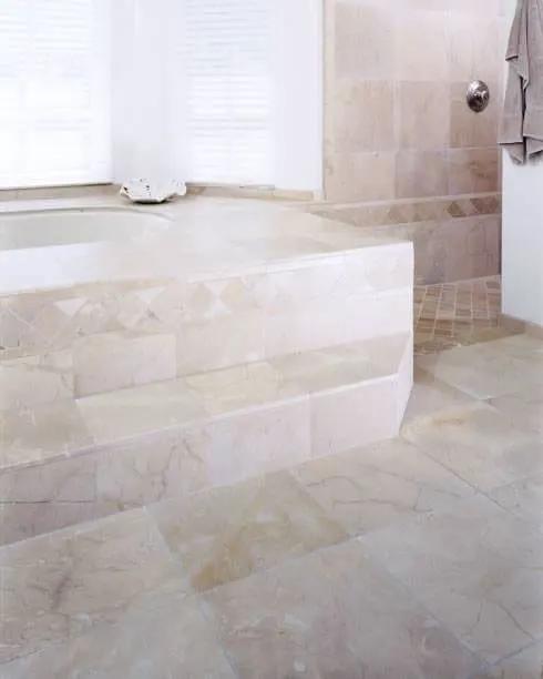Crema Marfil Polished Marble Tiles 12x24 in a finished room