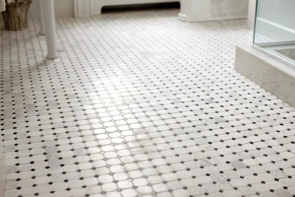 Greecian White 2" Octagon With Black 5/8x5/8 Polished In 12x12 Mesh Marble Mosaics in a finished room