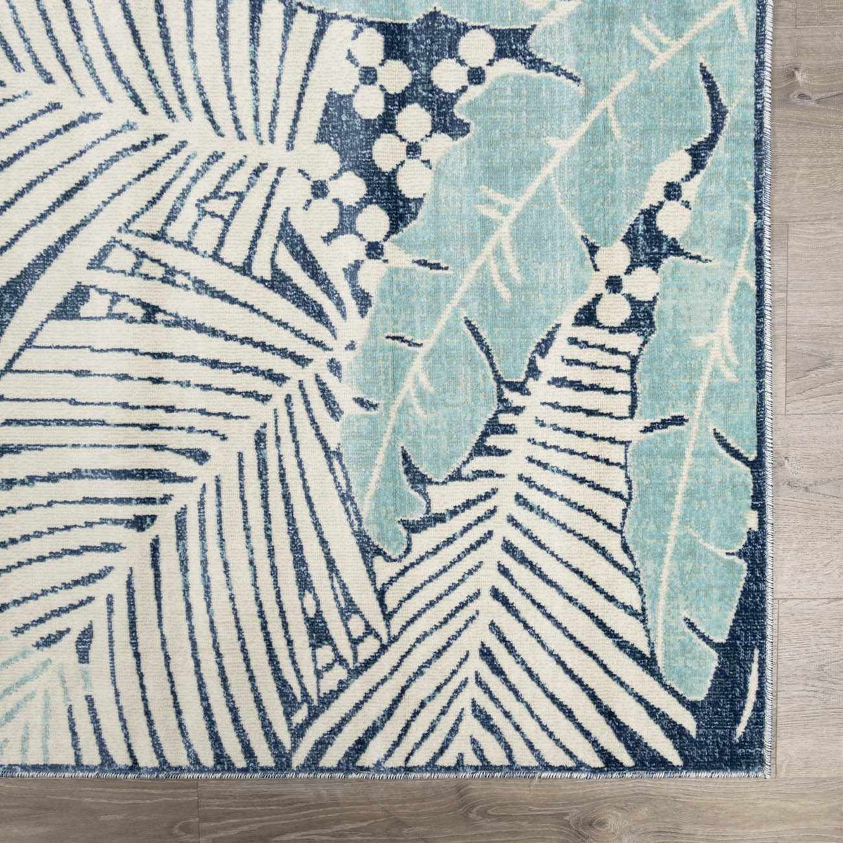 Thebarton Coastal Blue Palm Outdoor Area Rug, sample swatch