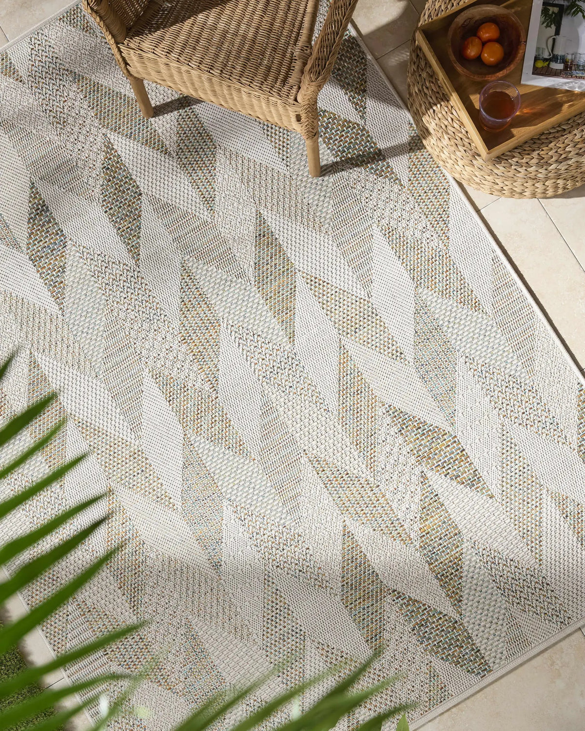 Andrea Ivory Outdoor Area Rug, installed in a room