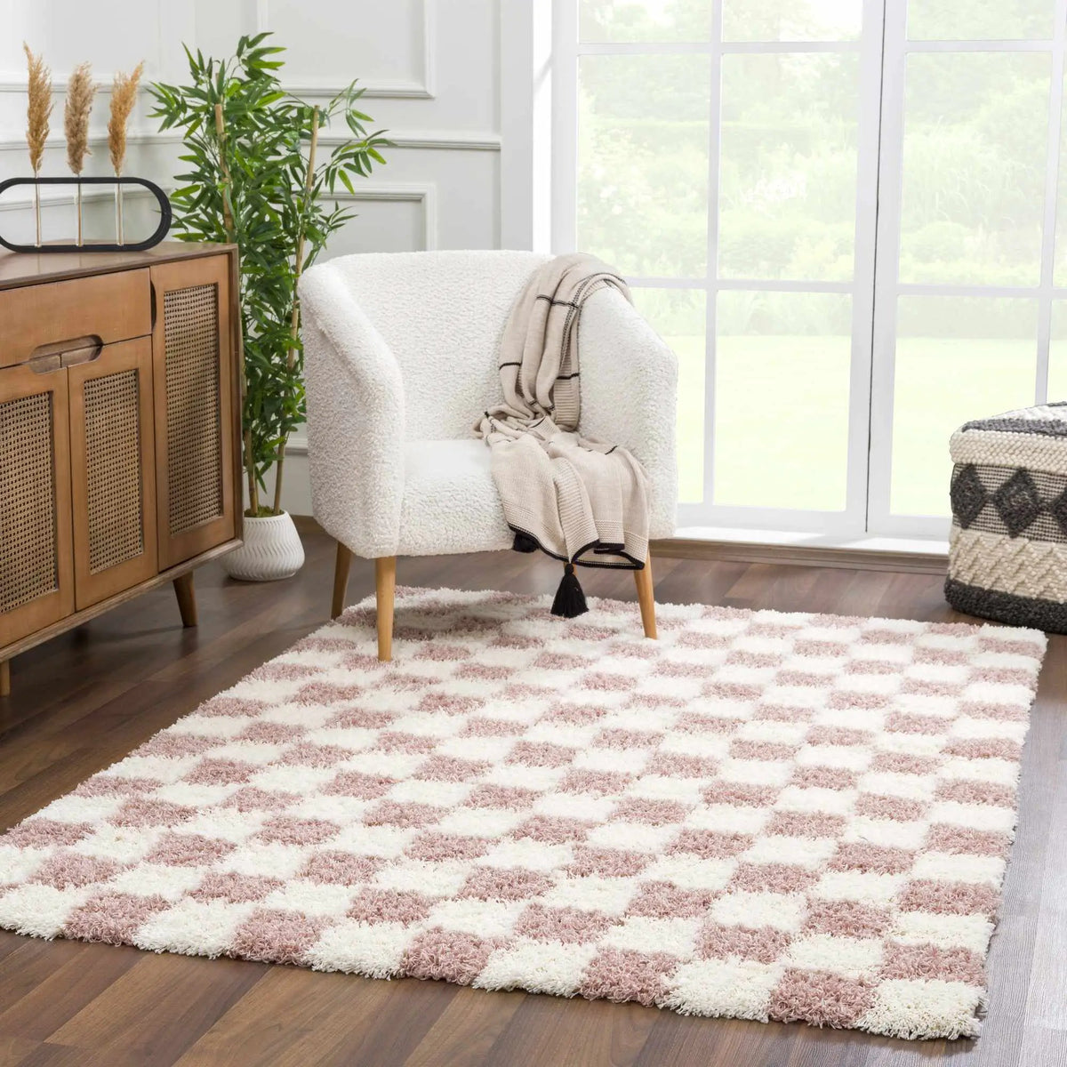 Atira Pink Checkered Area Rug, installed in a room