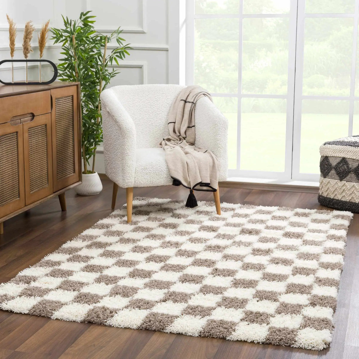 Atira Brown Checkered Area Rug, installed in a room