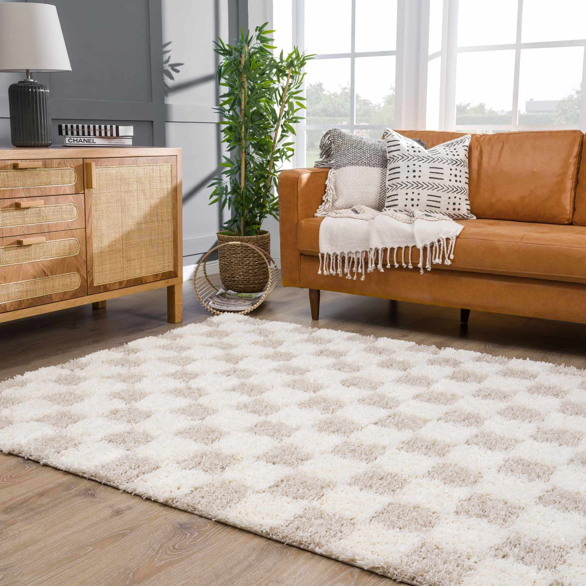 Atira Light Brown Checkered Area Rug, installed in a room