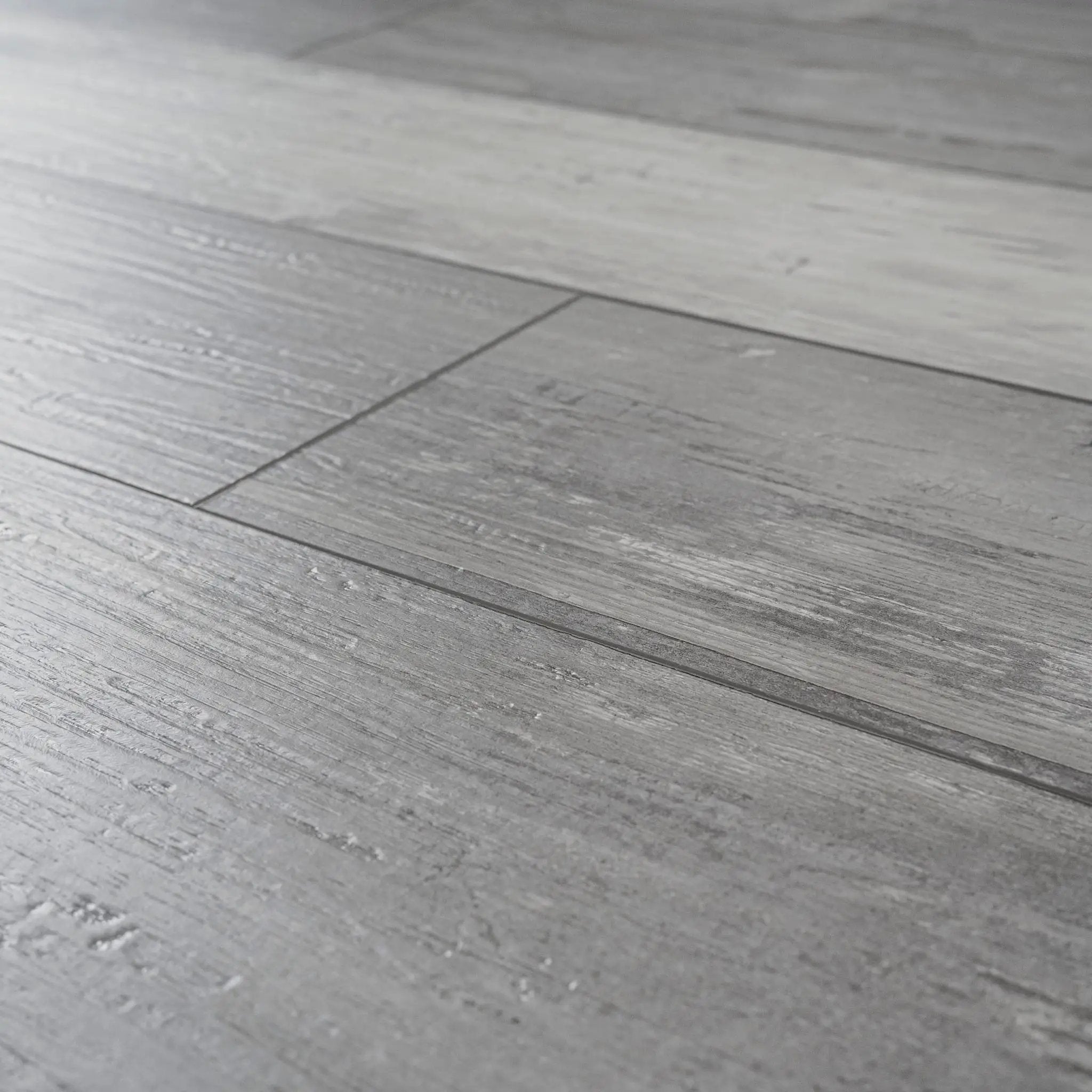 Andover Kingsdown Gray Semi Gloss Overlap Stair Nose Wood Look Lvt Moldings 2.23x1.03 angled view
