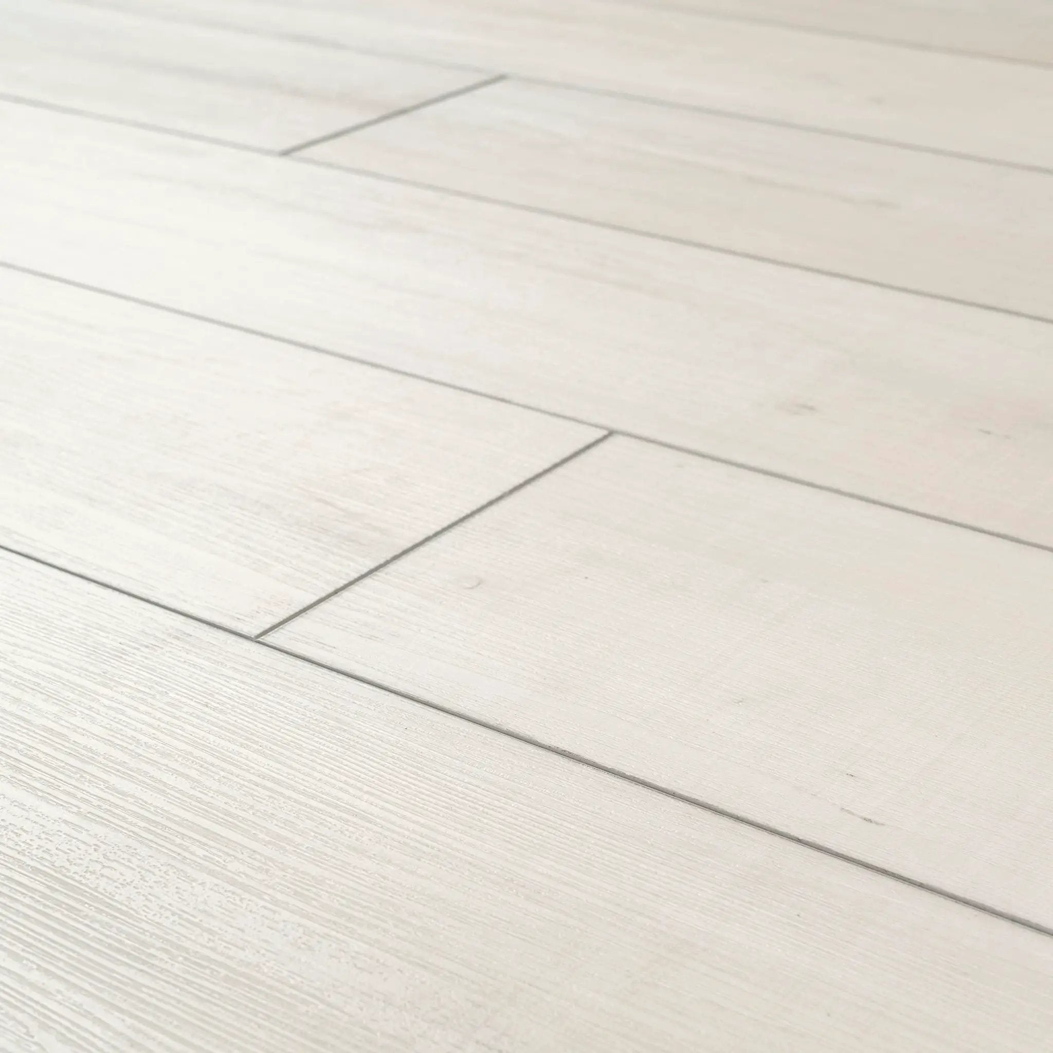 Andover Whitby White Semi Gloss Wood Look Lvt Moldings 12x1.25 angled view