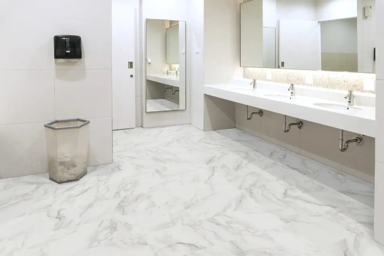 Trecento Calacatta Venosa Gold Semi Gloss T Molding Marble Look Lvt Moldings 1.77x0.28 in a finished room