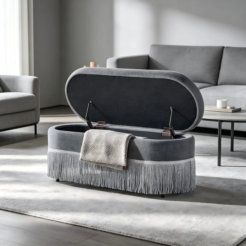 Oval Upholstered Storage Ottoman with Fringe Trim by HouseOfZazla