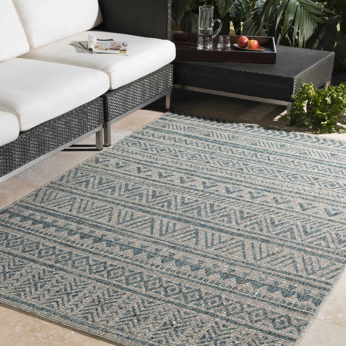 Novato Aqua All Over Pattern Performance Outdoor Rug, installed in a room