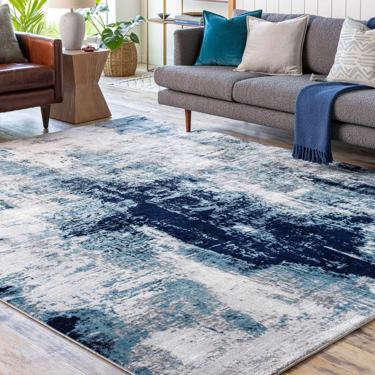 Apas Abstract Blue Area Rug, installed in a room