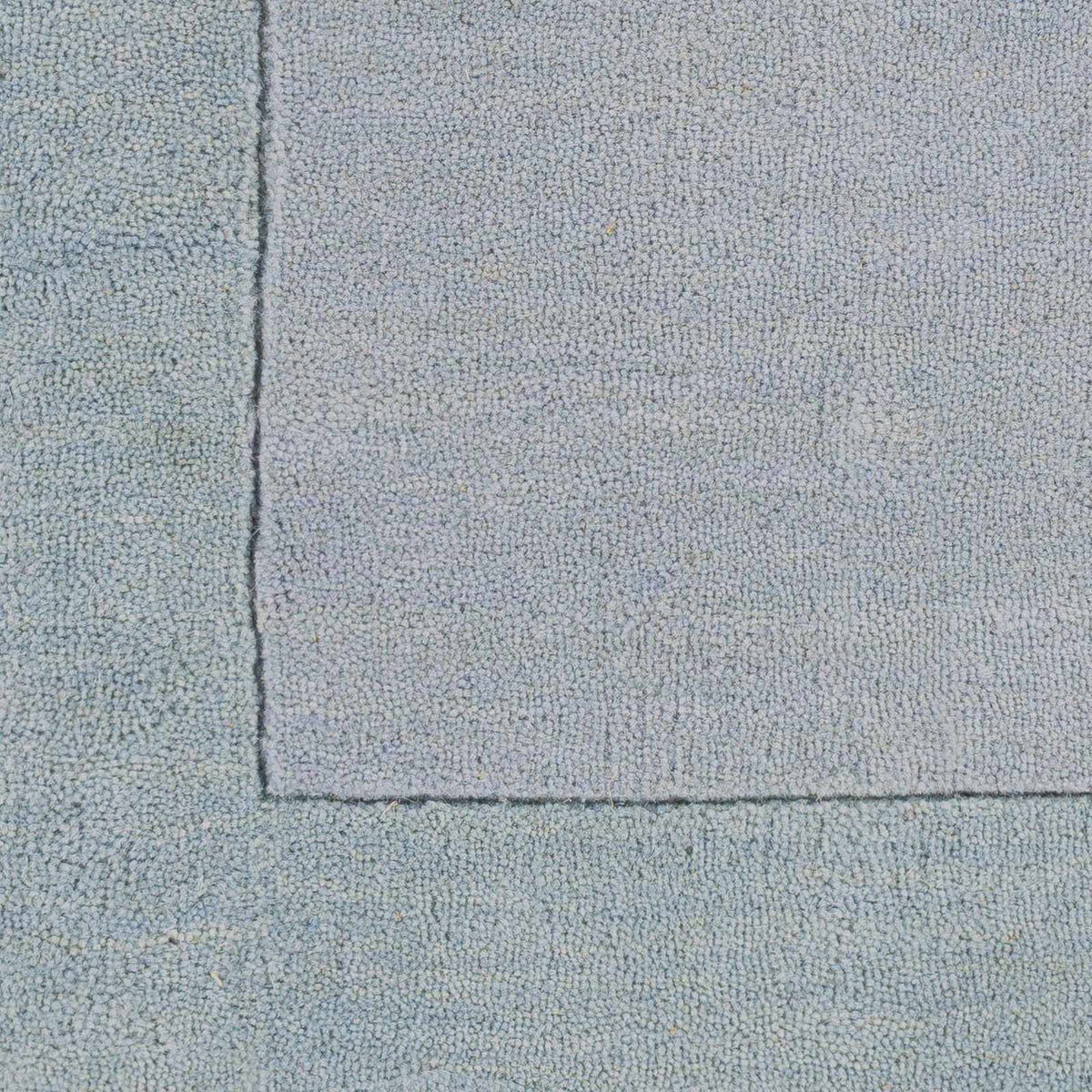 Arkabutla Solid Blue Bordered Wool Rug, sample swatch