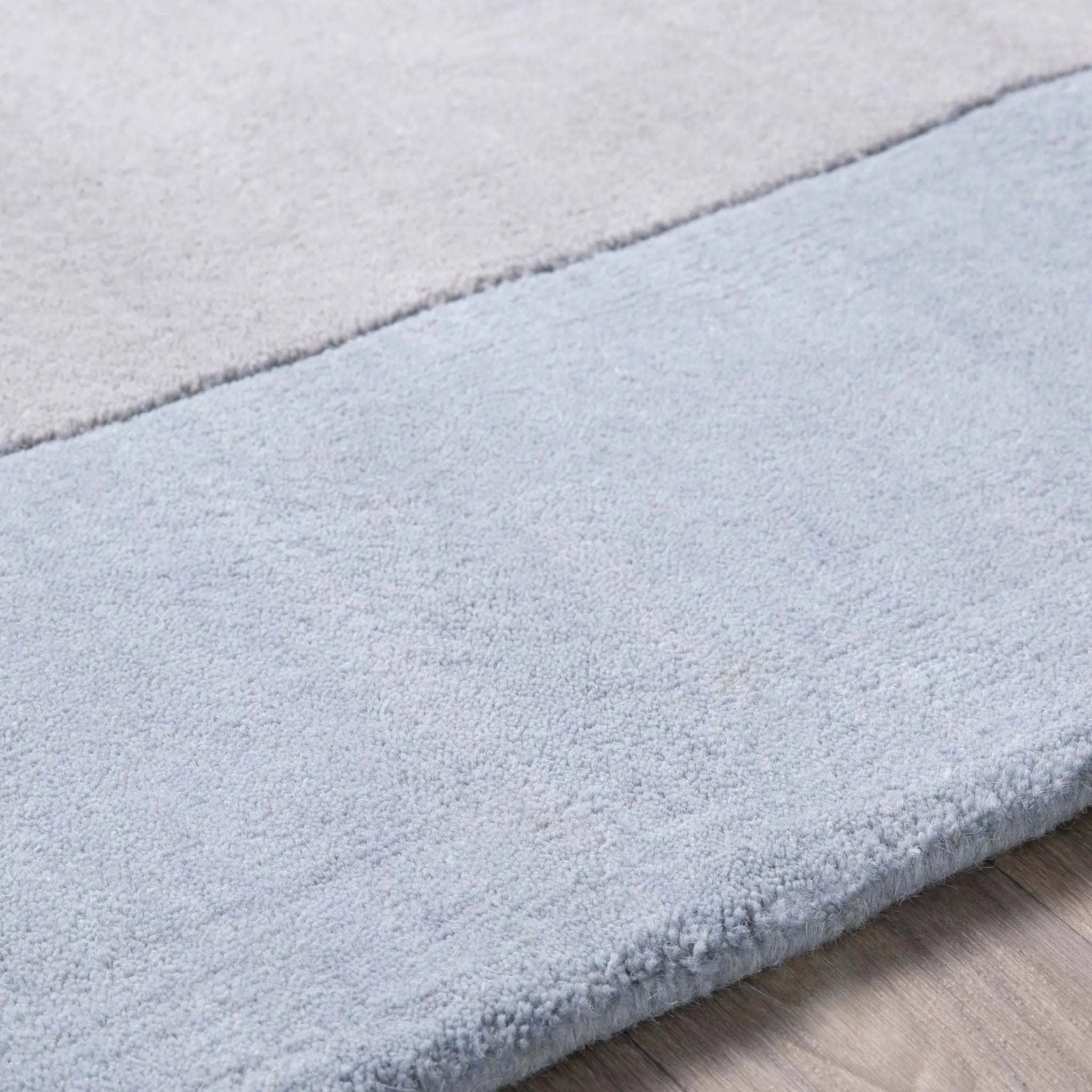 Arkabutla Solid Blue Bordered Wool Rug by Boutique Rugs