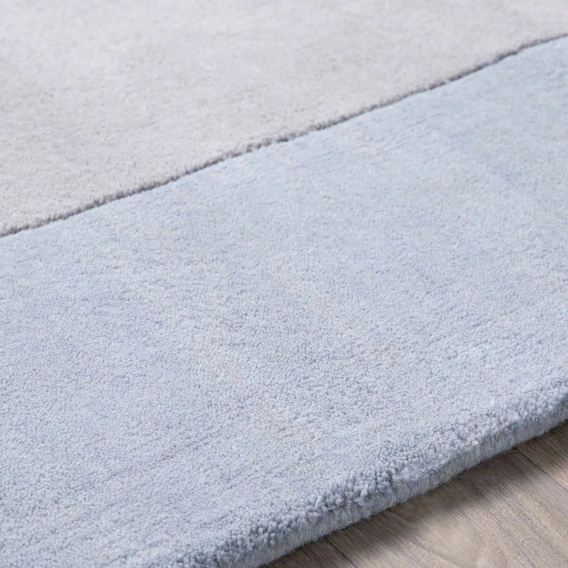 Arkabutla Solid Blue Bordered Wool Rug by Boutique Rugs