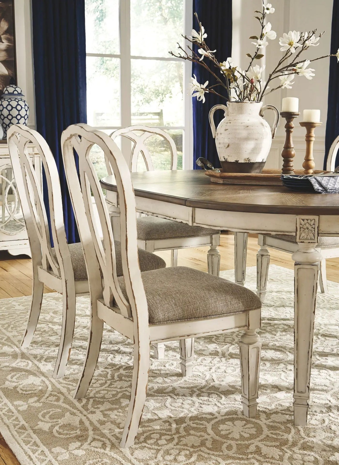 Realyn - Oval Dining Table Set by Unique Piece Furniture