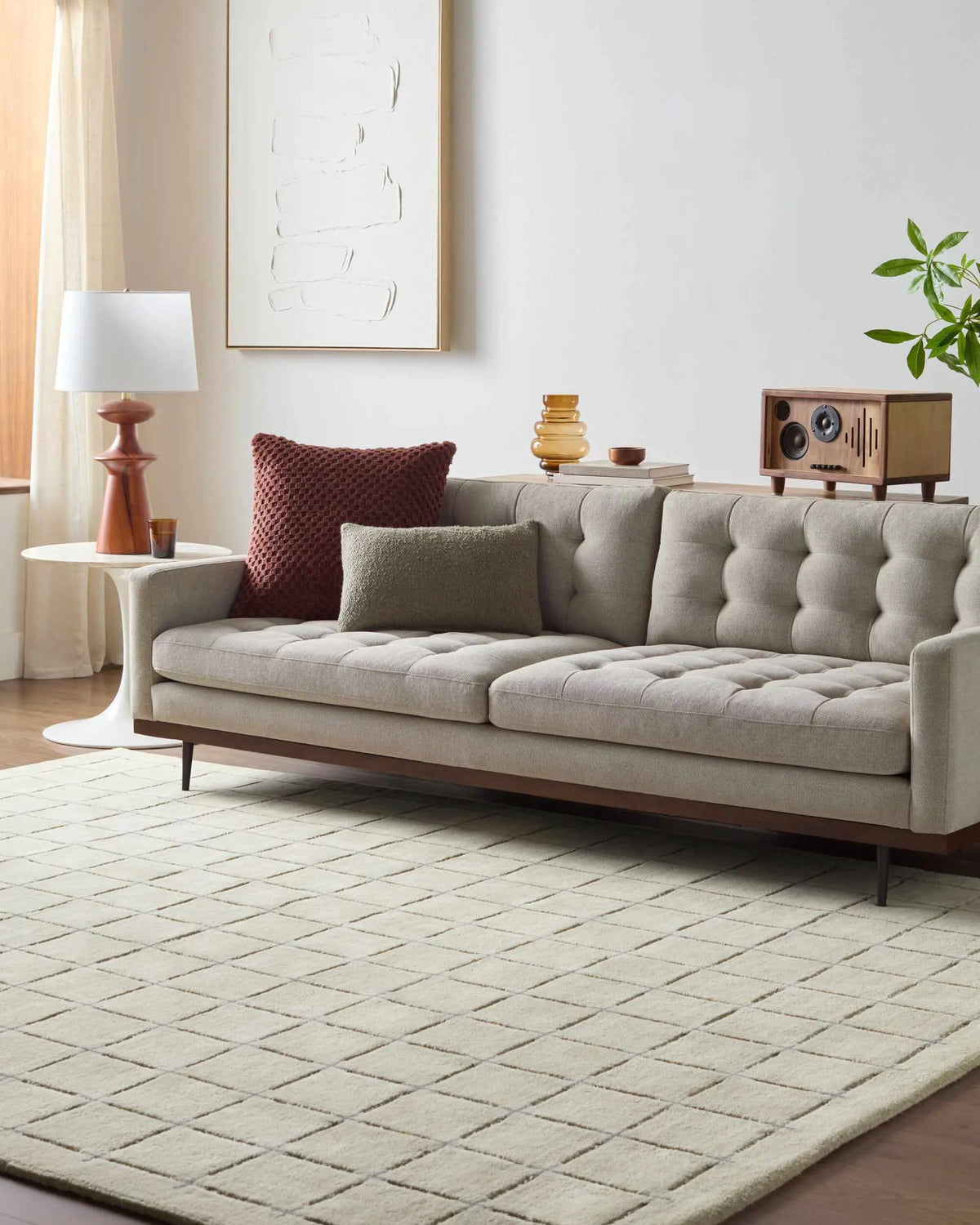 Sanvi Tan Area Rug, installed in a room