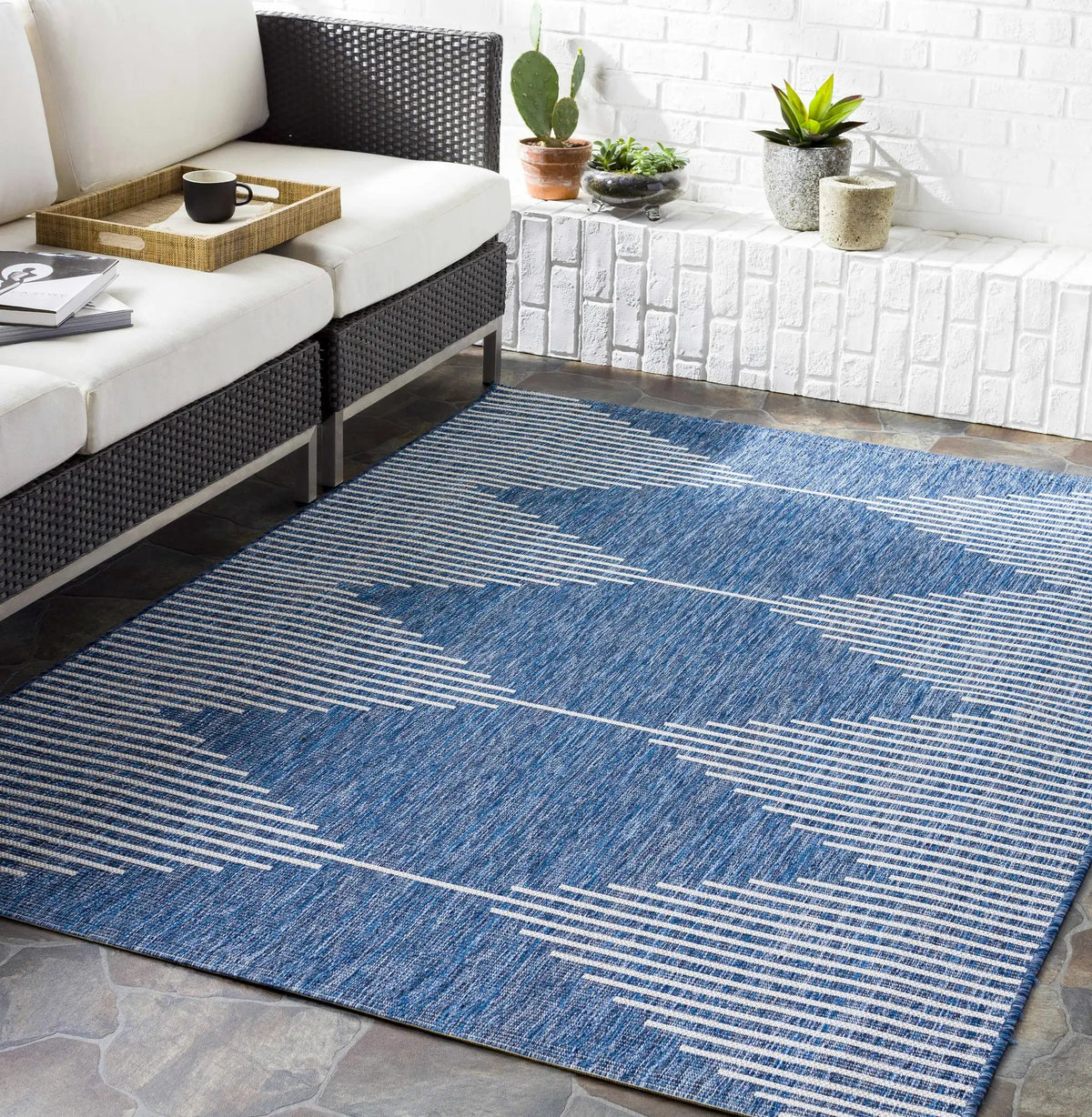 Stephan Navy Outdoor Rug, installed in a room