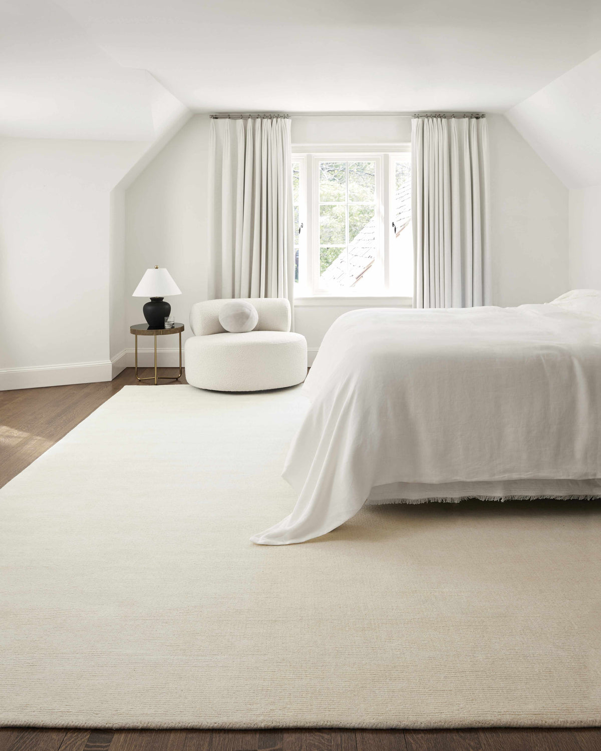 Brockton Solid Light Beige Wool Rug, installed in a room