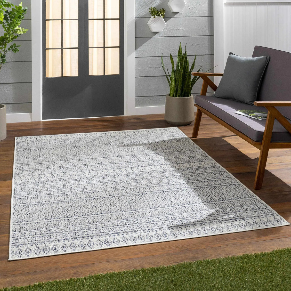 Madras Navy All Over Performance Outdoor Rug, installed in a room 2