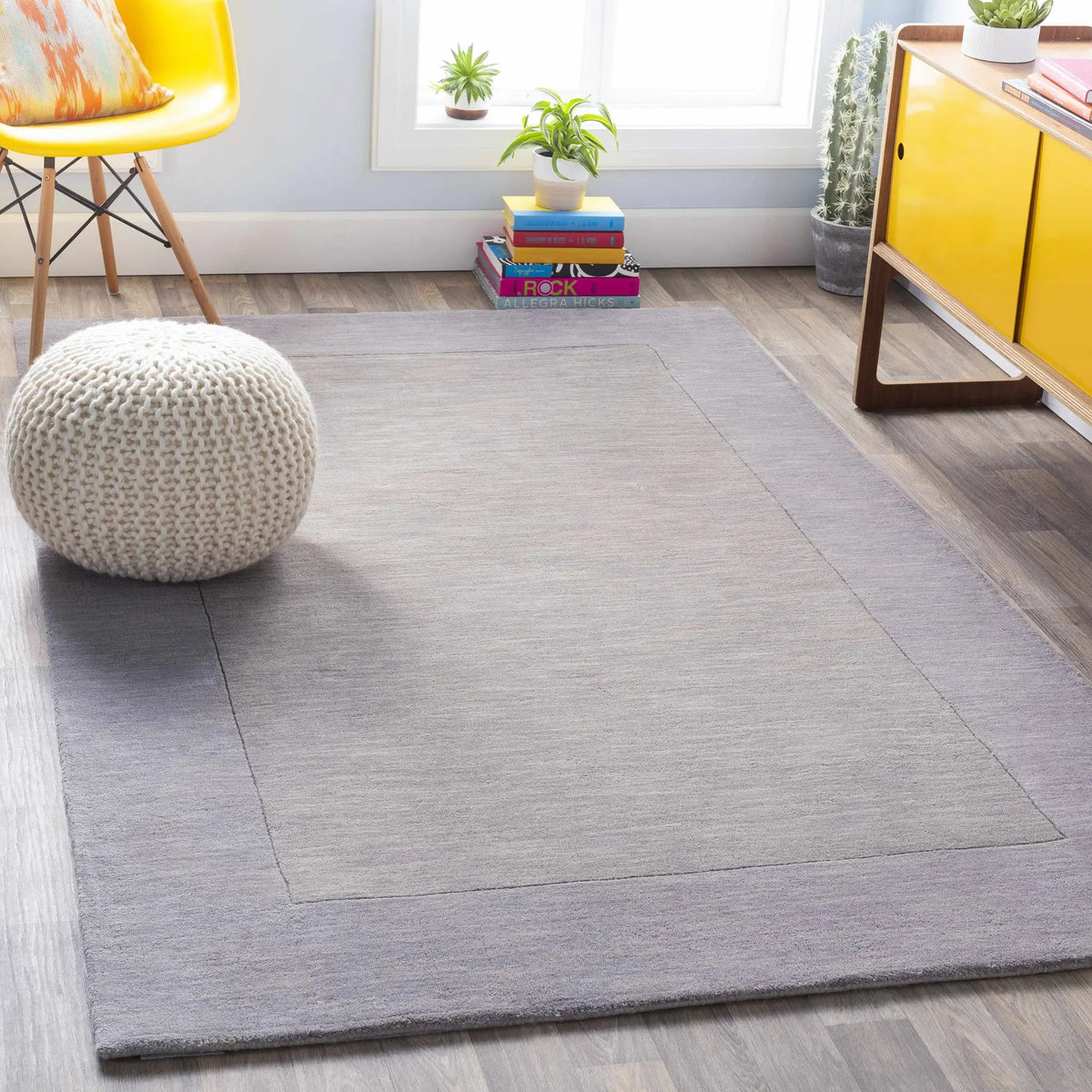 Bordered Solid Gray Wool Rug, installed in a room