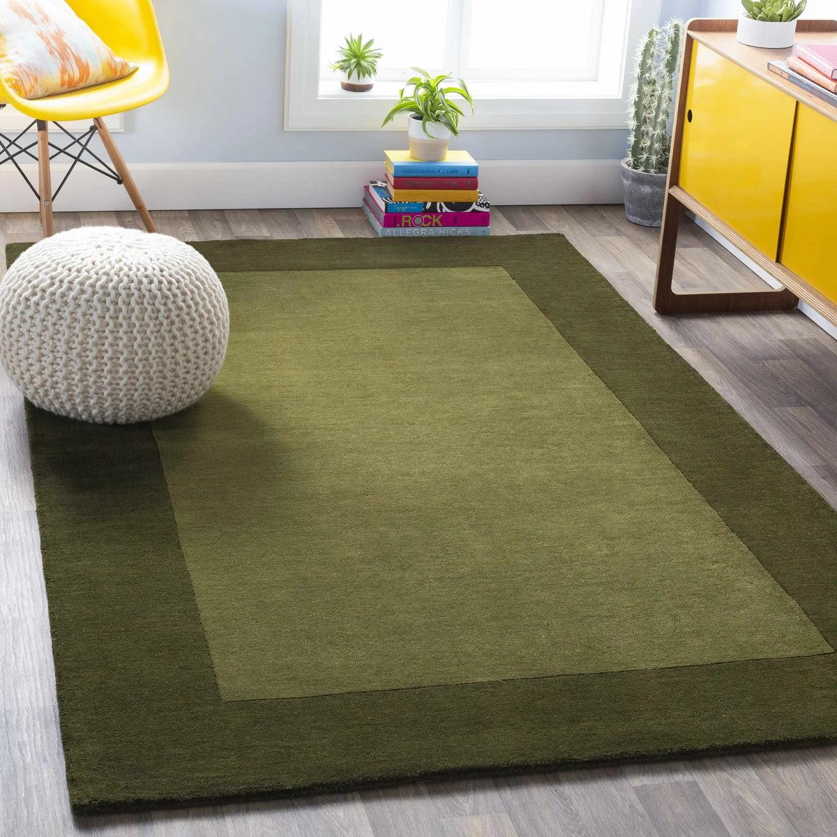 Bordered Solid Olive Green Wool Rug, installed in a room