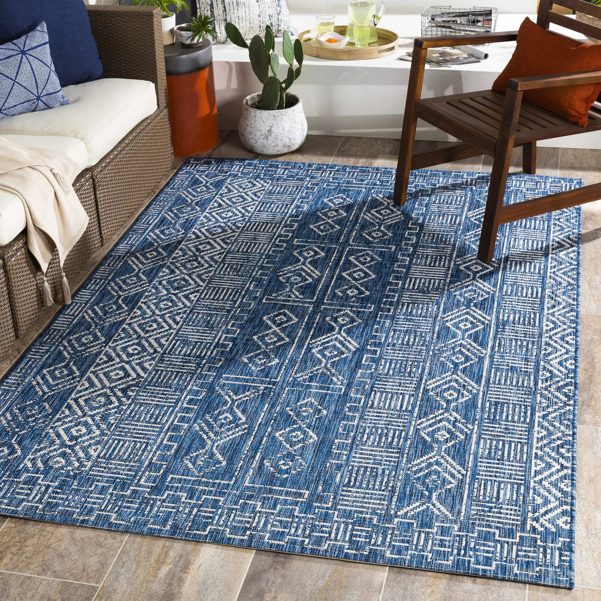 Deeth Outdoor Area Rug - Clearance, installed in a room