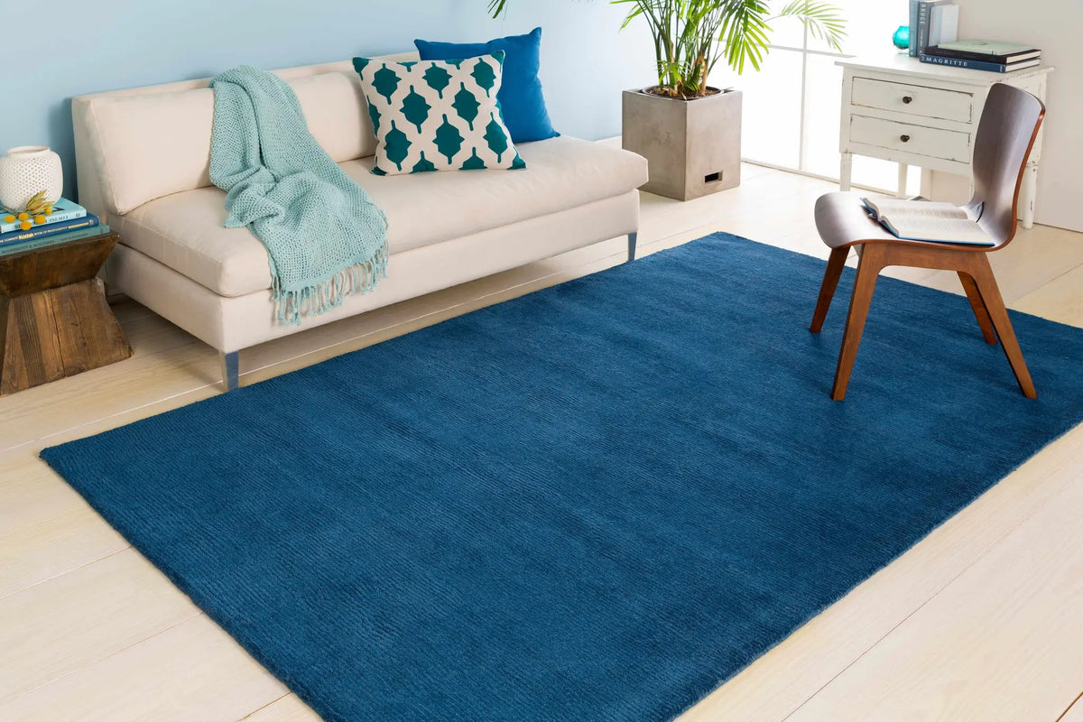 Brockton Solid Blue Wool Rug, installed in a room 2