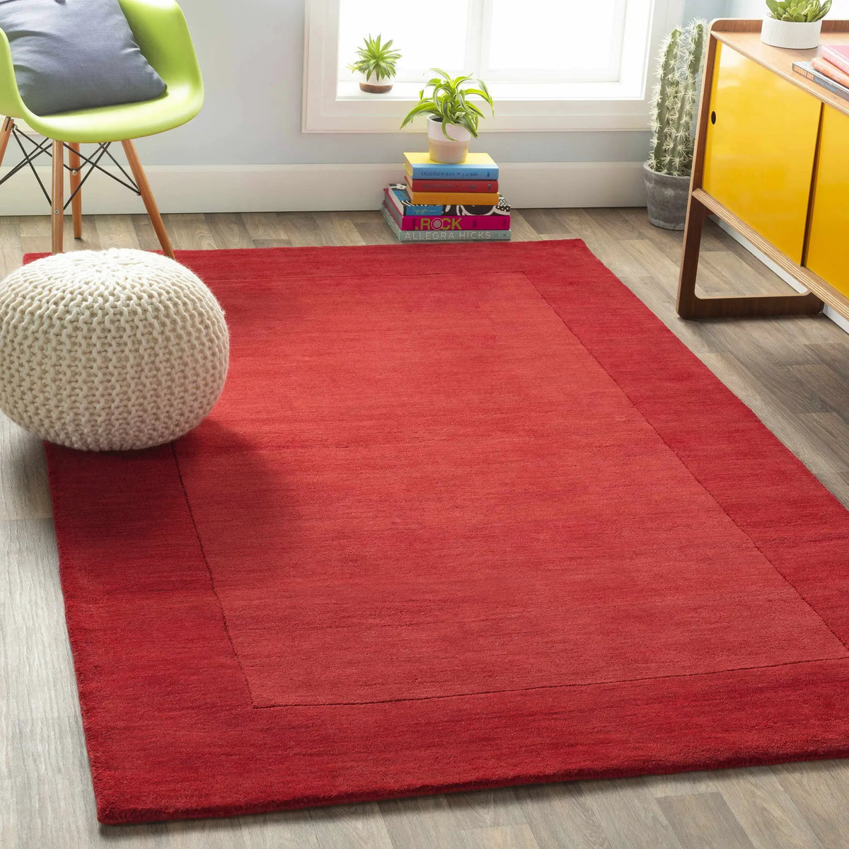 Bordered Solid Red Wool Rug, installed in a room