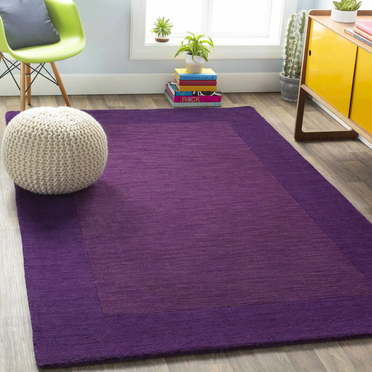 Bordered Solid Plum Purple Wool Rug, installed in a room