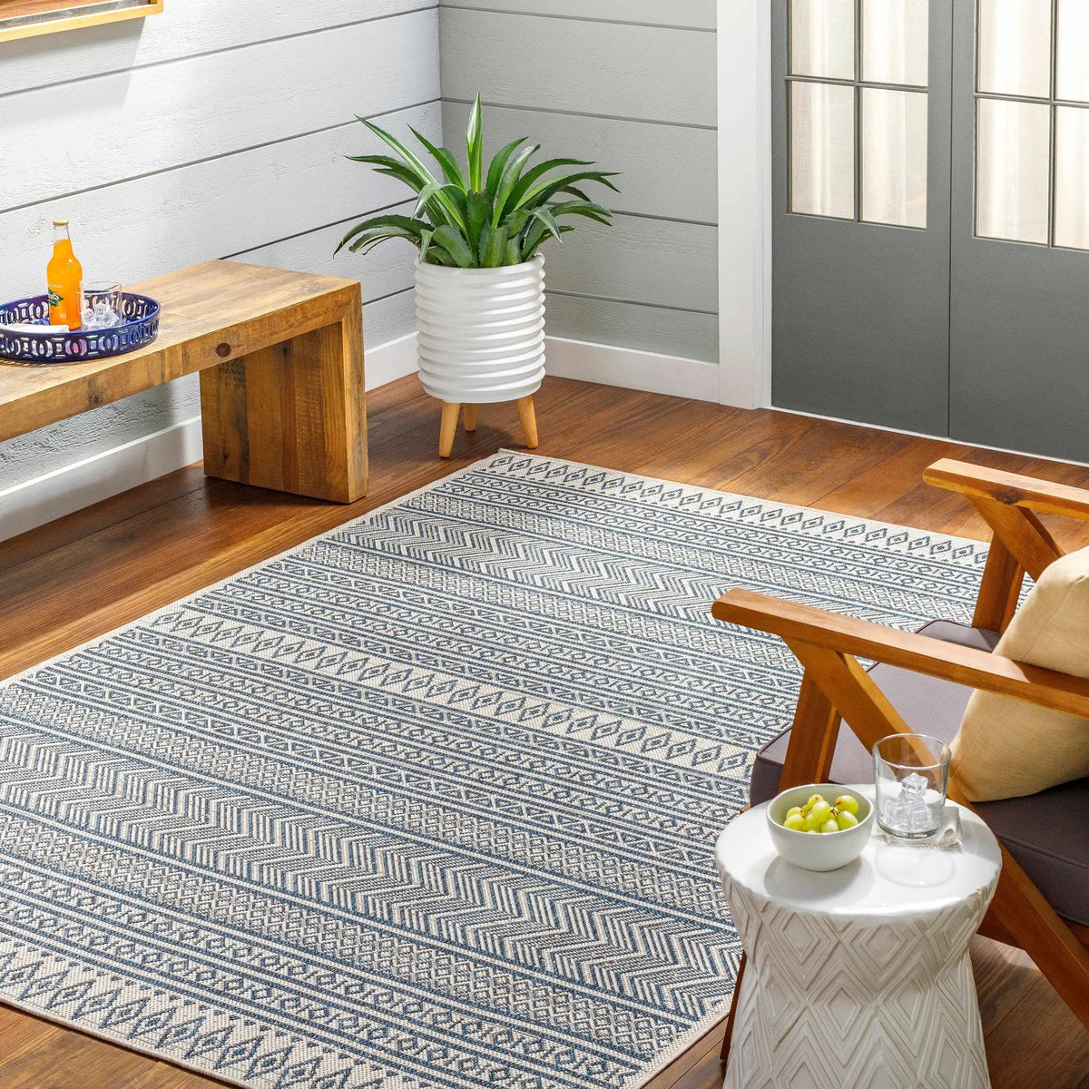 Madras Ink All Over Performance Outdoor Rug, installed in a room