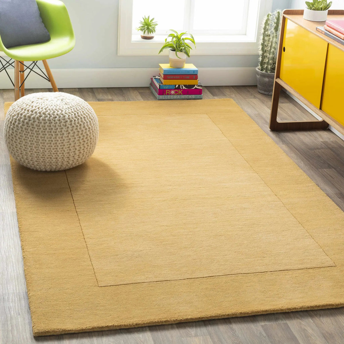 Bordered Solid Camel Yellow Wool Rug, installed in a room