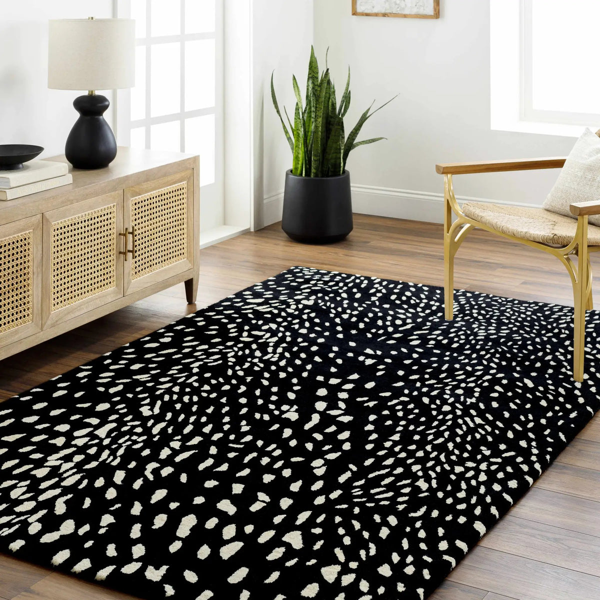 Athena Black Giraffe Print Wool Rug, installed in a room