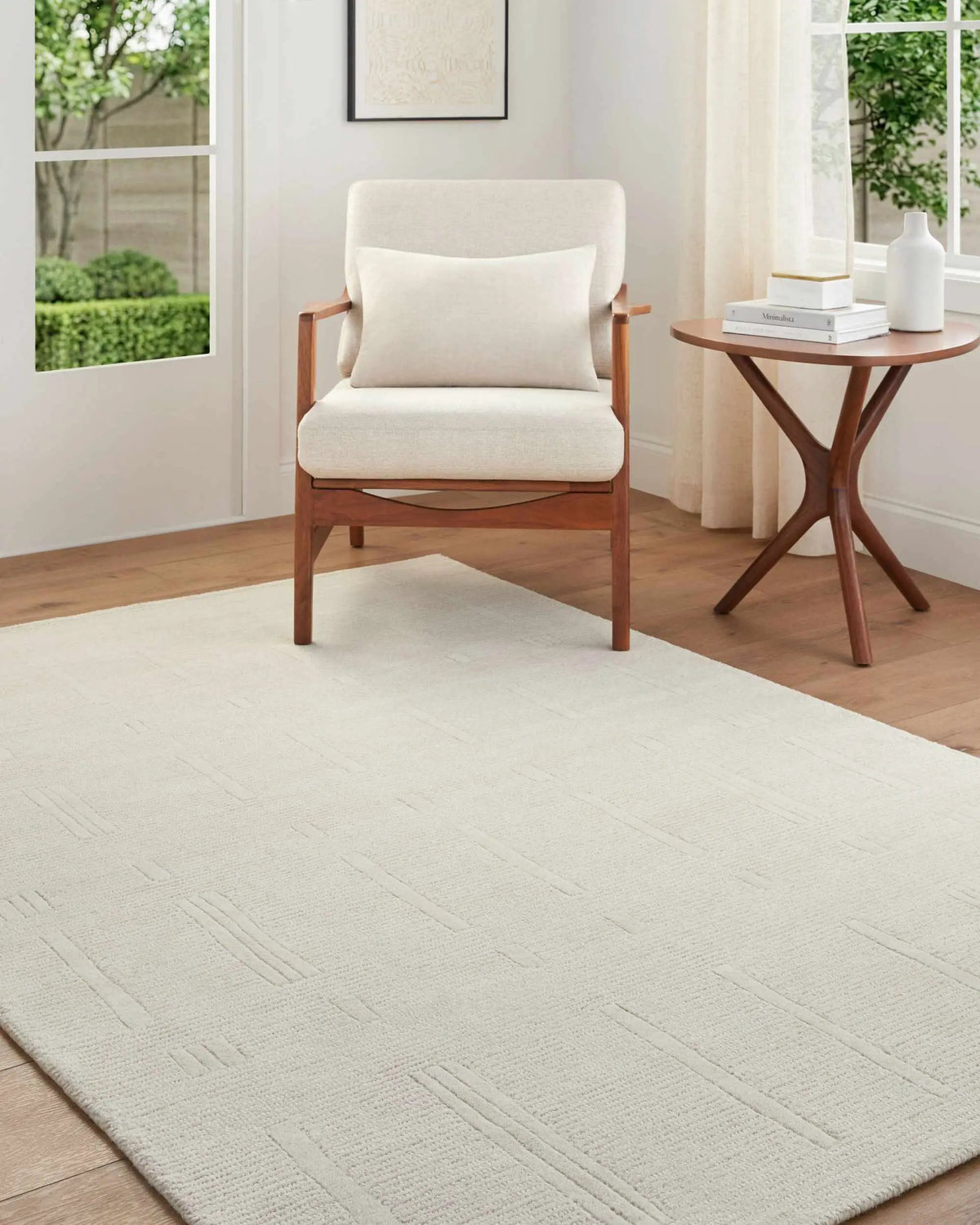Charan Ivory Cream Area Rug, installed in a room