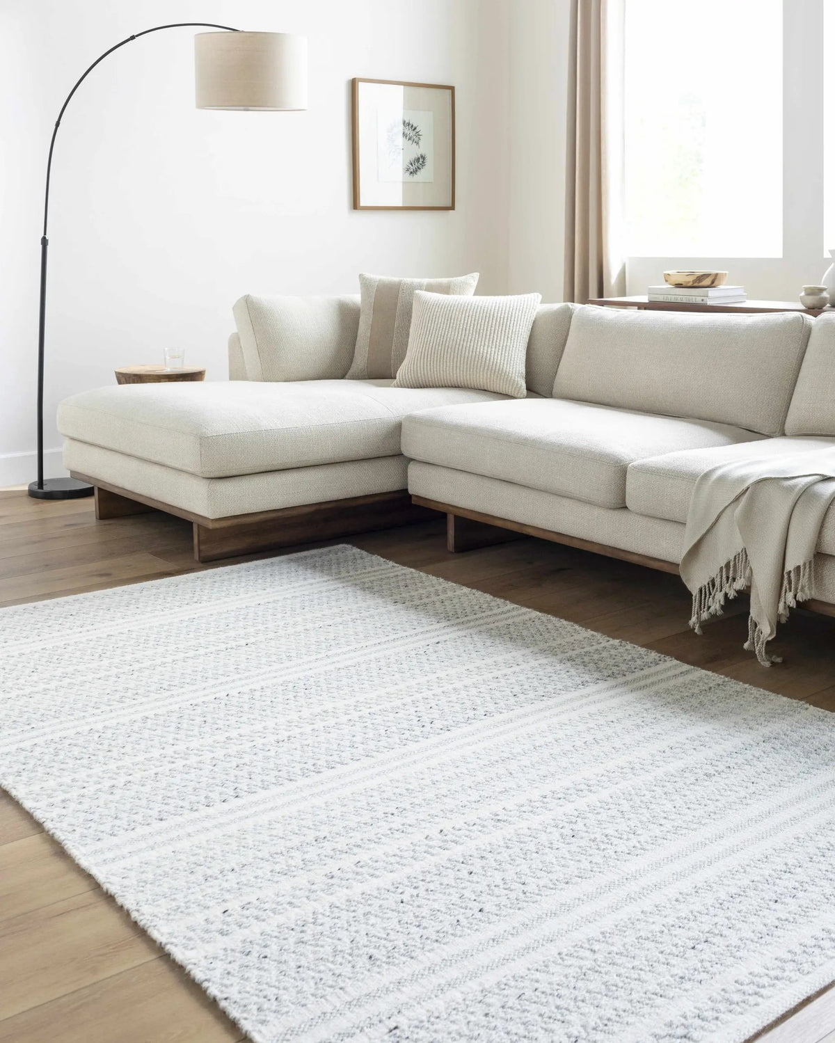Kendi Cream Area Rug - Clearance, installed in a room