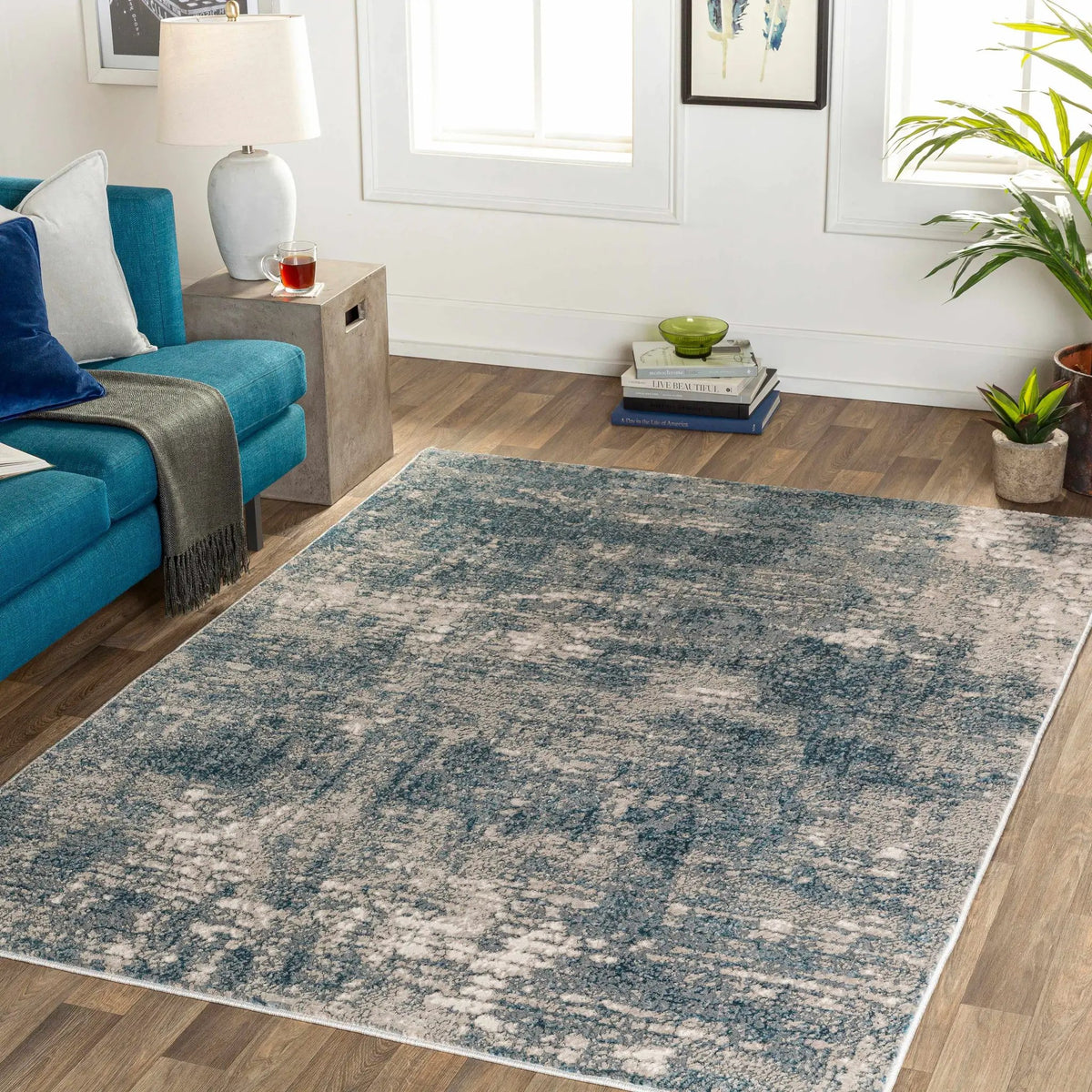 Kiblawan Teal Abstract Area Rug - Clearance, installed in a room