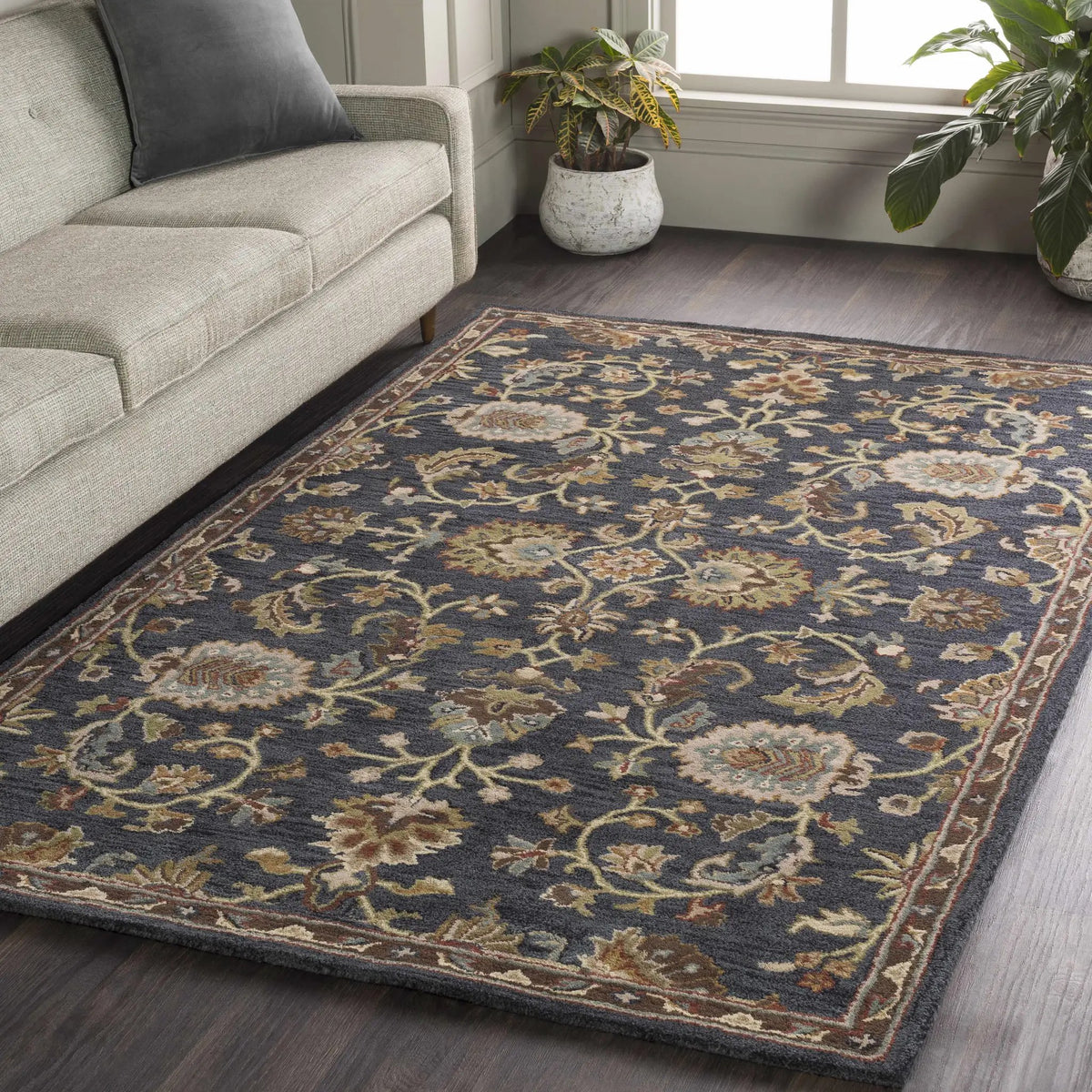 Kittredge Floral Black Wool Rug, installed in a room