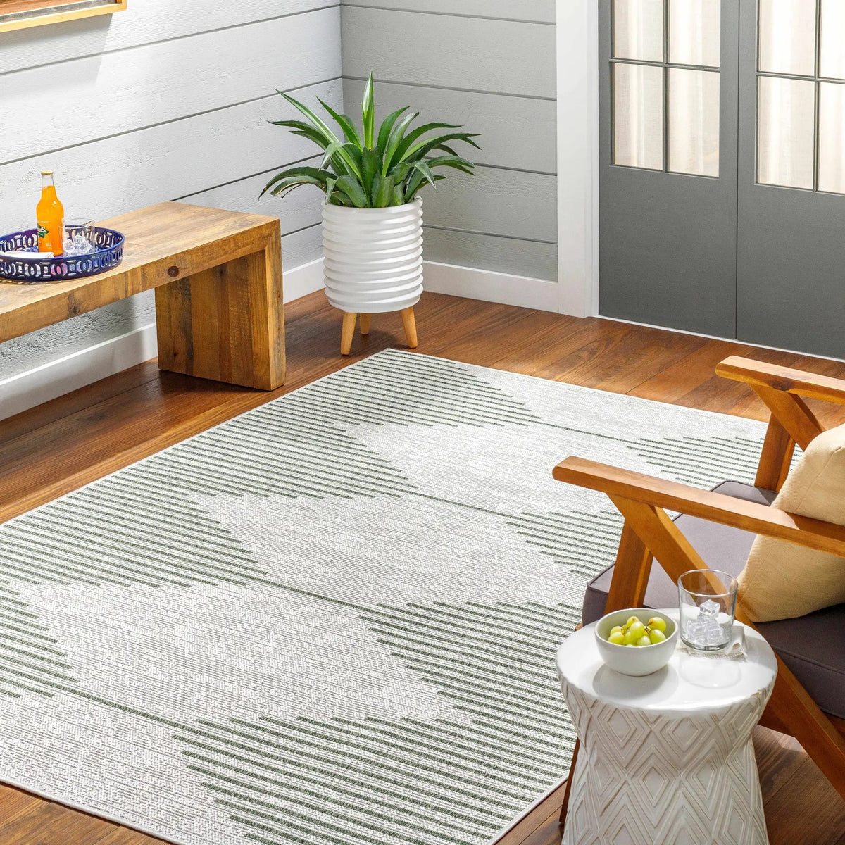 Stephan Green Outdoor Rug, installed in a room