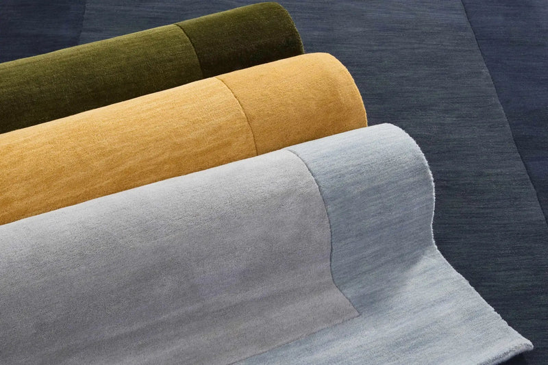 Arkabutla Solid Blue Bordered Wool Rug by Boutique Rugs