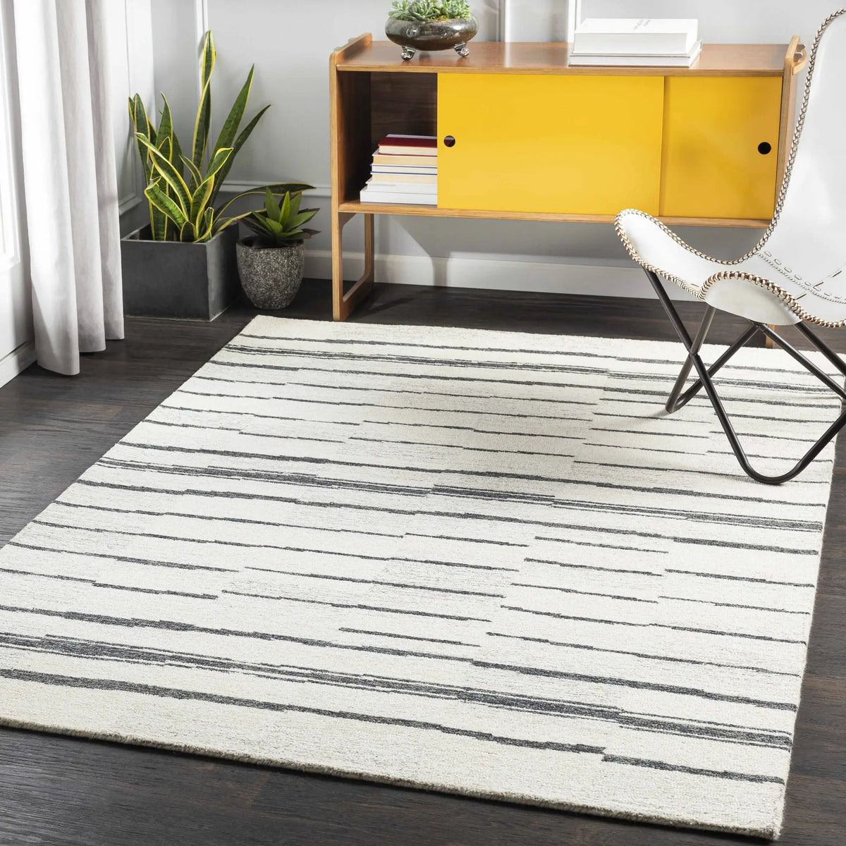 Moorebank Black Striped Wool Rug, installed in a room