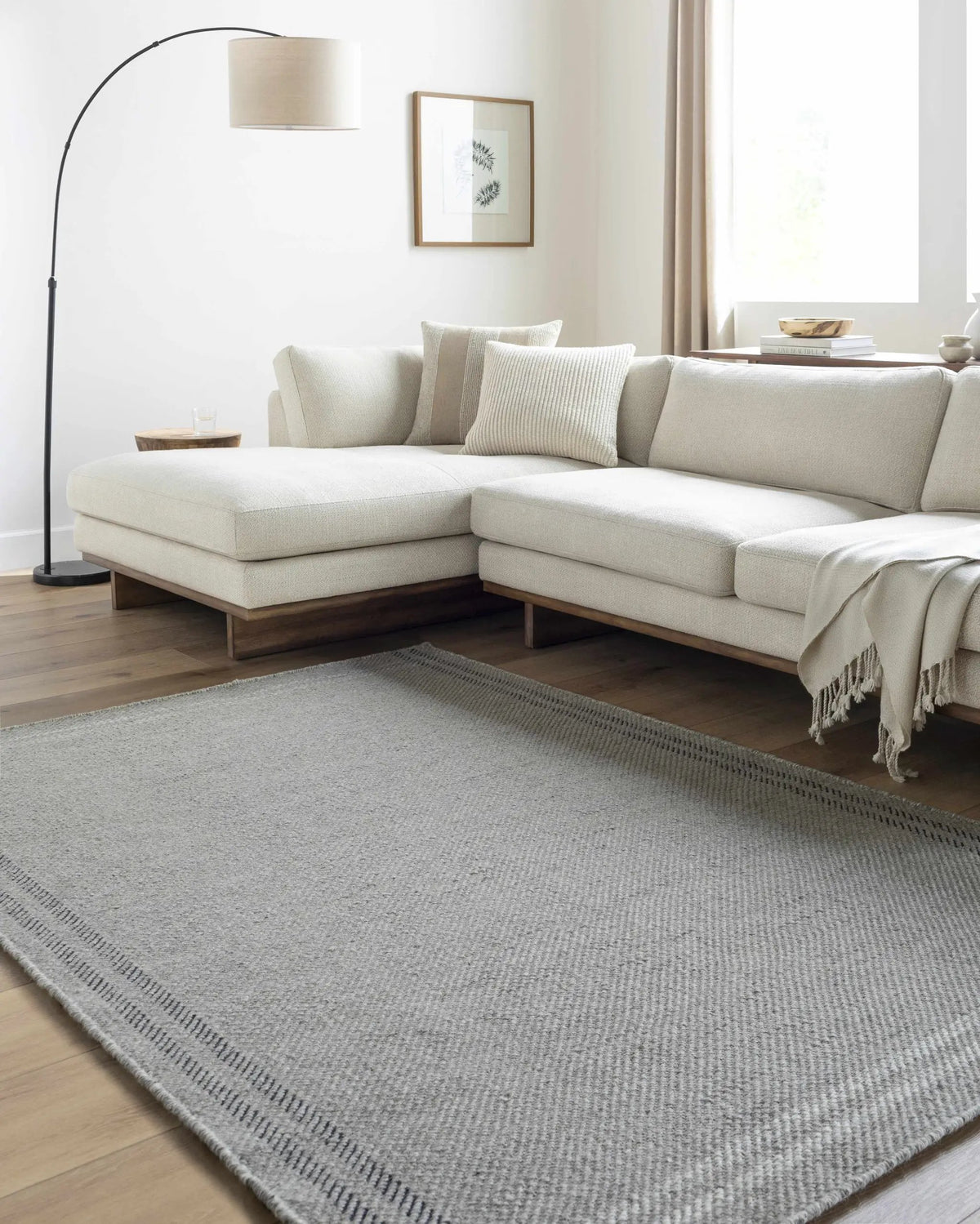Nimue Ivory Area Rug - Clearance, installed in a room
