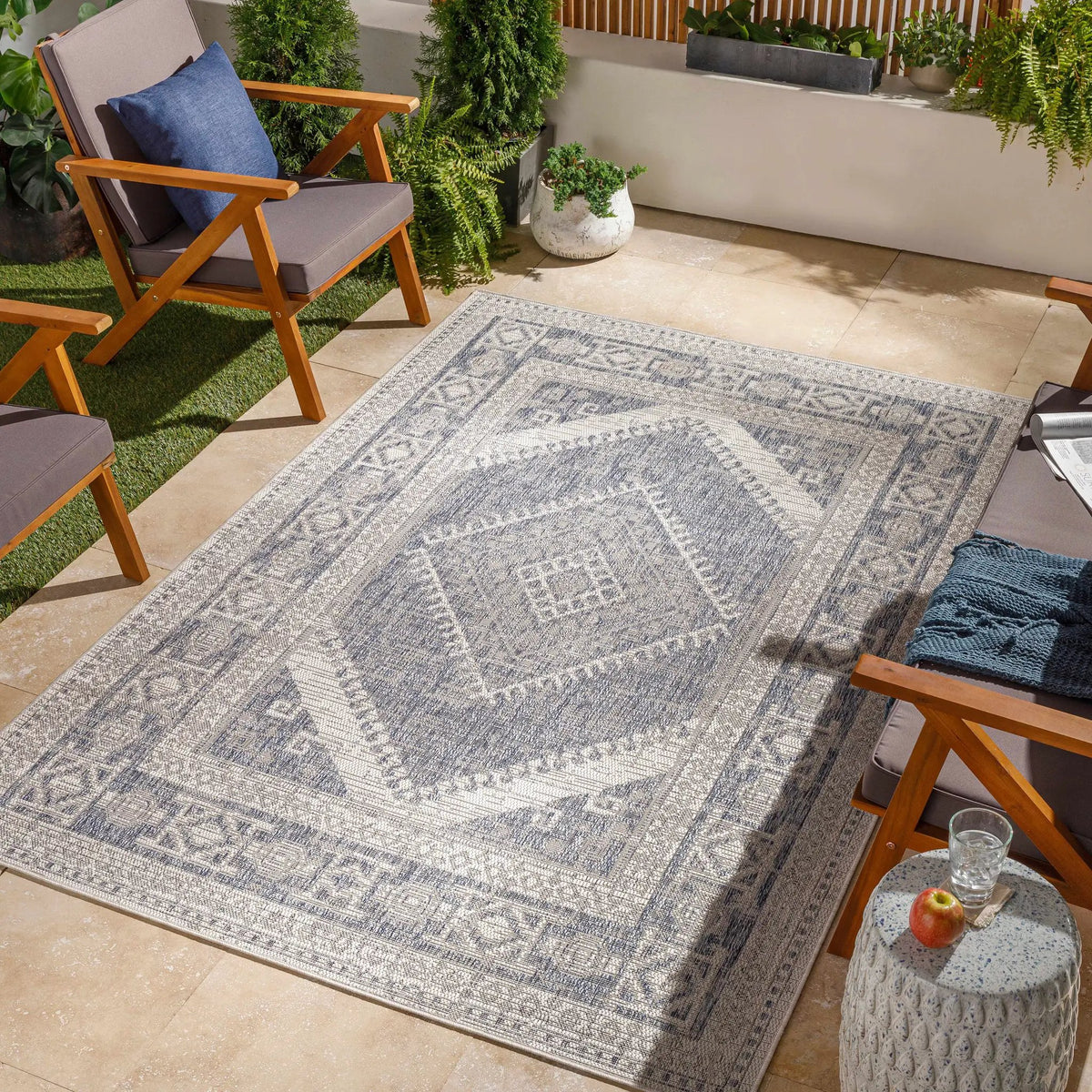 Umraniye Gray Outdoor Area Rug, installed in a room
