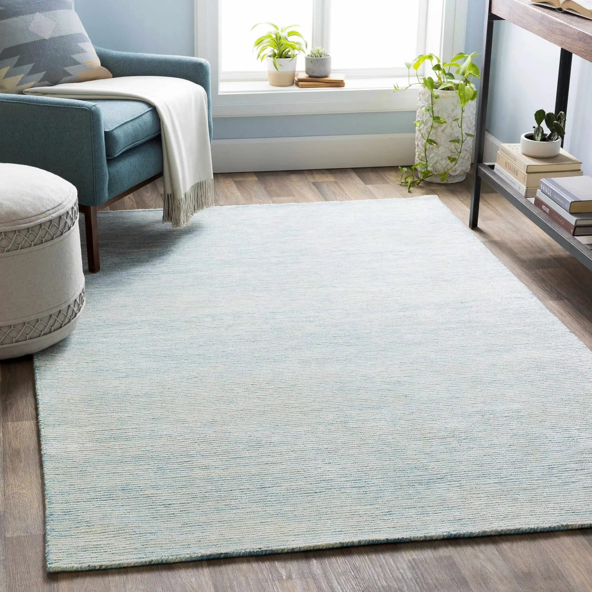 Orcas Hand Tufted Wool-Blend Rug - Ice Blue, installed in a room