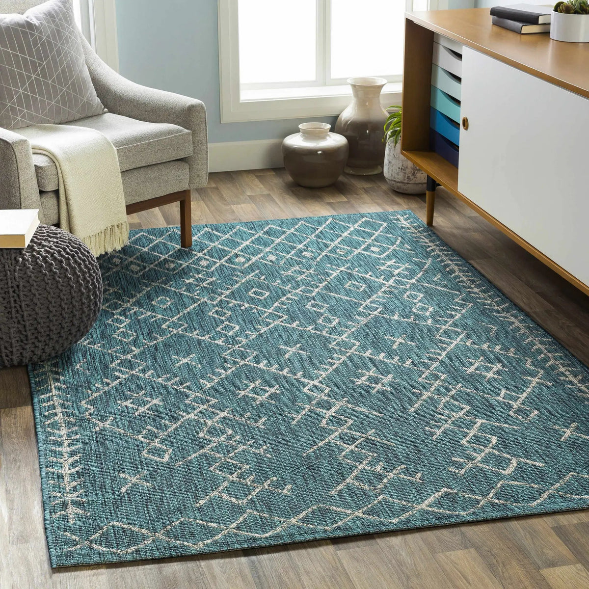 Maunawili Aqua Nordic Outdoor Rug, installed in a room