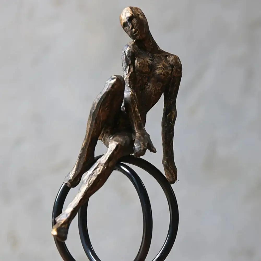 Abstract Seated Figure Sculpture on Geometric Stand – Modern Iron Table Decor by House Of Avana