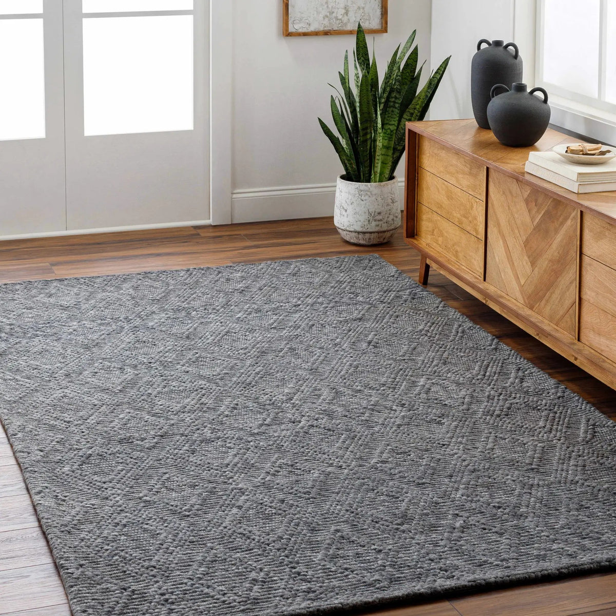Kasib Dark Gray Hand Woven Area Rug - Clearance, installed in a room