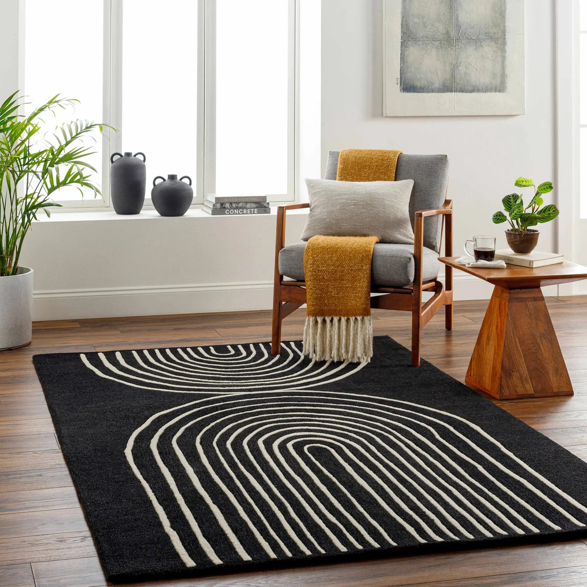 Fuat Black Wool Rug, installed in a room